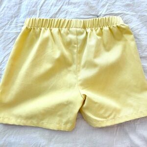 Little English boys short in yellow